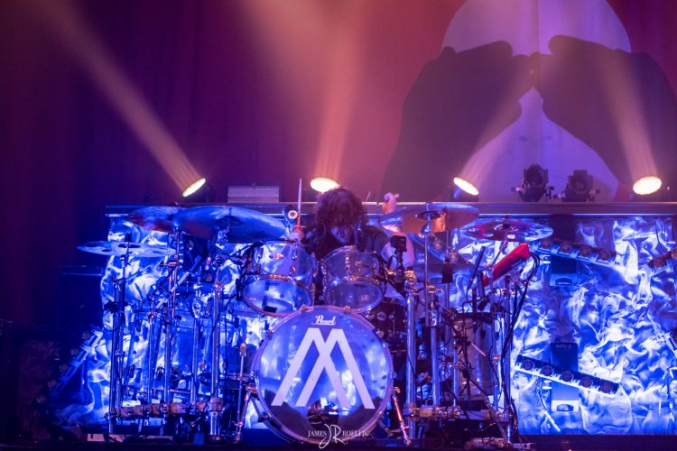 Ben Anderson of Nothing More behind the drums at the House of Blues in Boston, MA with the lights making it look like a blue drum set